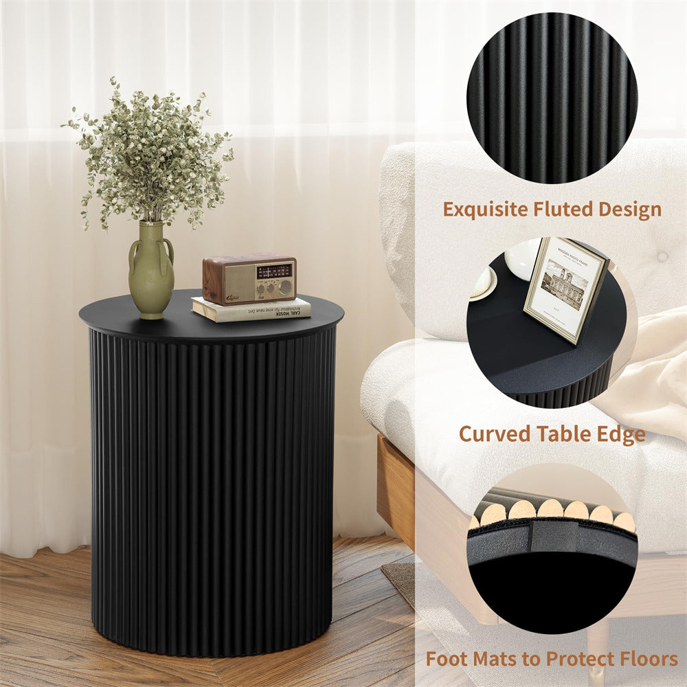 Black side table with decorative items in a living room setting, highlighting design features.
