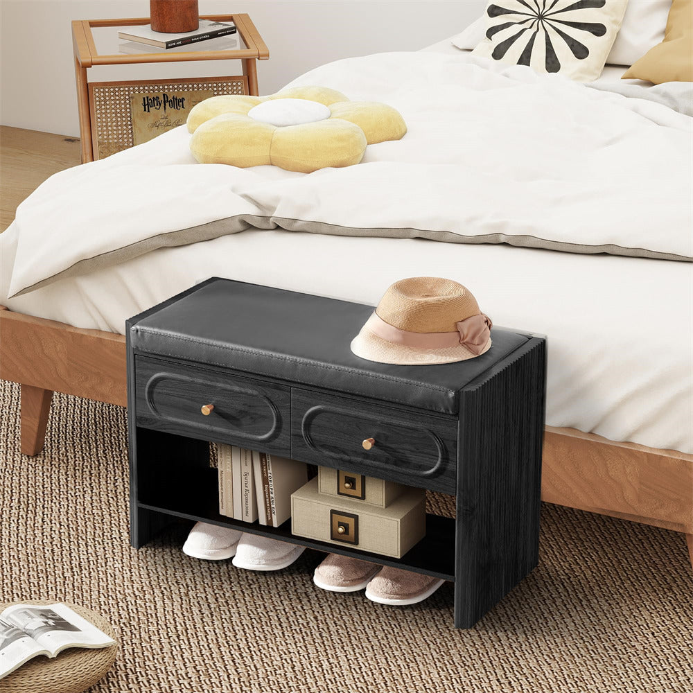 Black storage bench with drawers in a bedroom setting