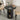 Round black dining table with chairs in a room setting