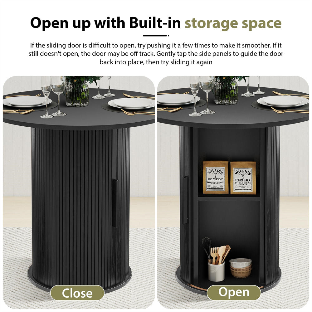 Black round table with sliding door design, open to reveal storage space.