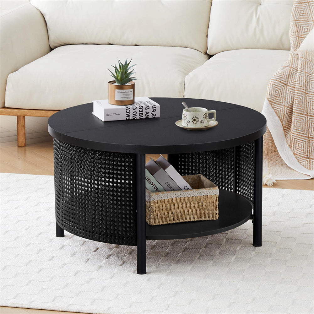 Black round coffee table with decorative items in a living room setting