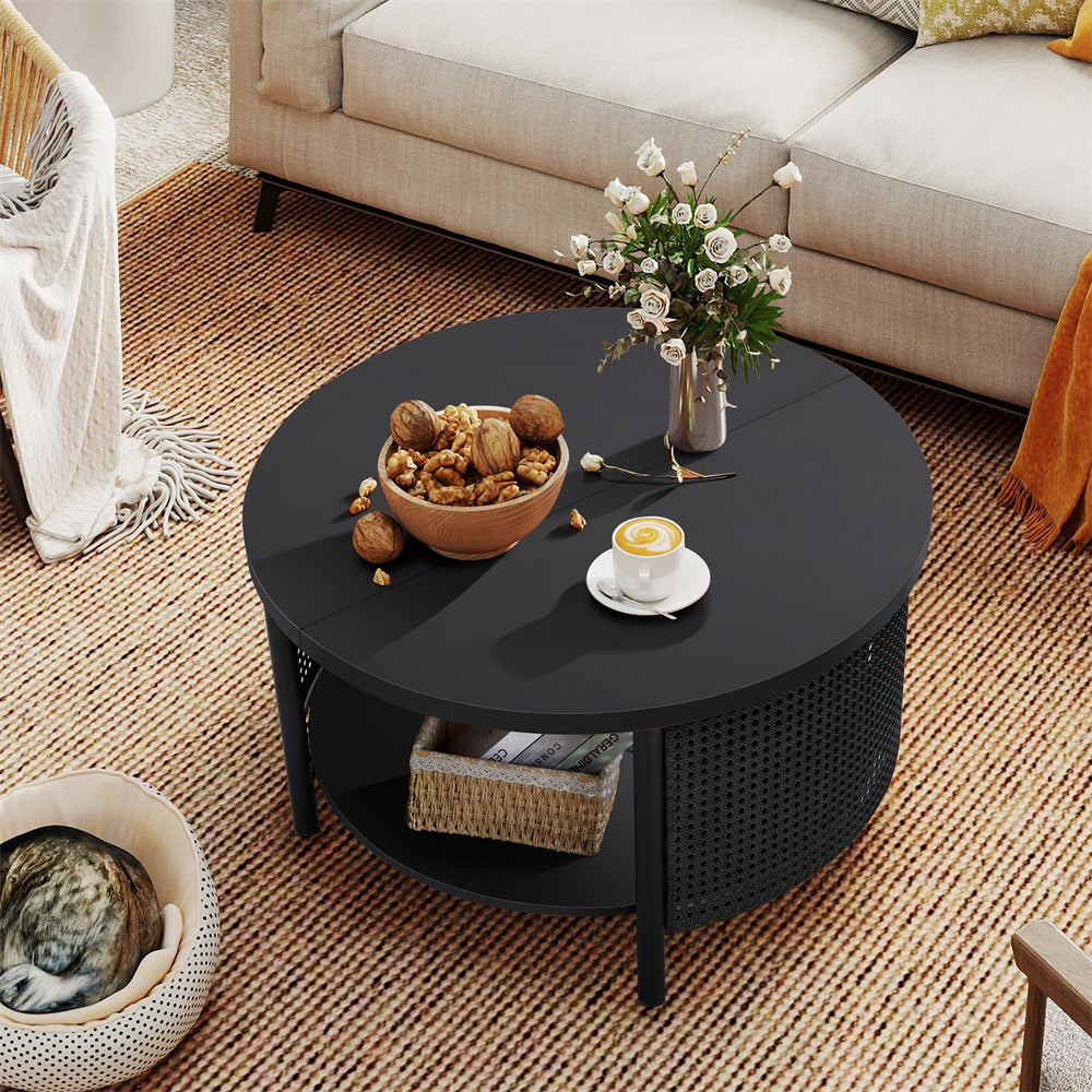 Round black coffee table with decorative items in a living room setting