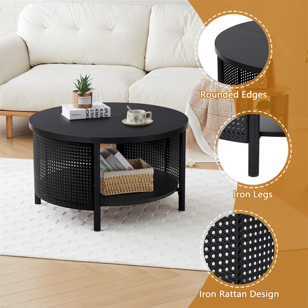 Black round coffee table with iron legs and rattan design in a living room setting.