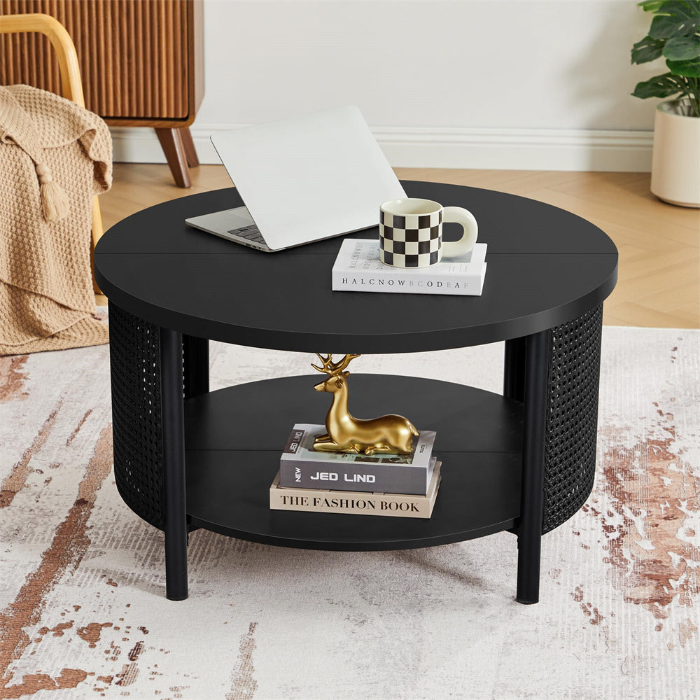 Black round coffee table with decorative items in a living room setting