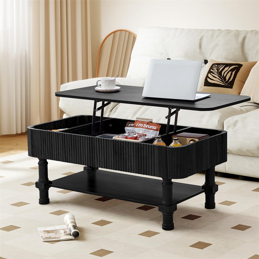 Black lift-top coffee table in a living room setting with a laptop and cup on top.