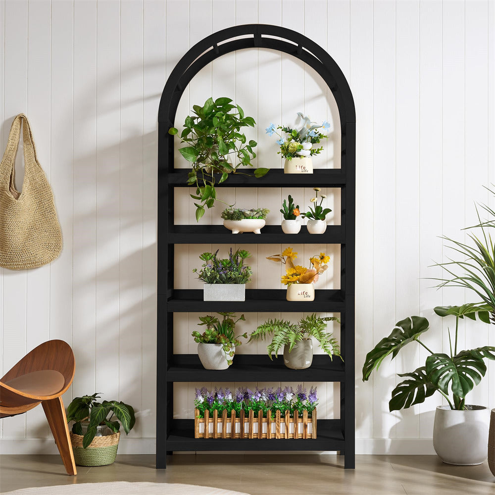 Black arch-shaped bookshelf with plants in a room setting