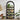 Black arch-shaped bookshelf with plants in a room setting