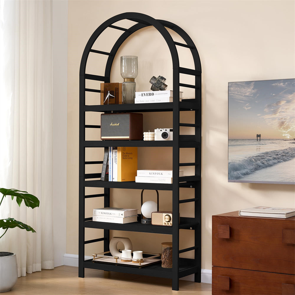 Black arch-shaped bookshelf with decorative items in a room with a TV and plant.