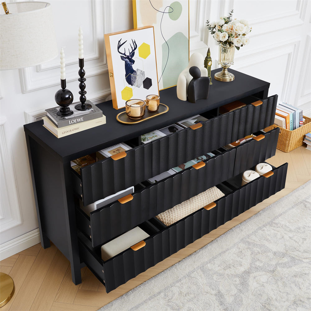Black dresser with multiple drawers in a room setting