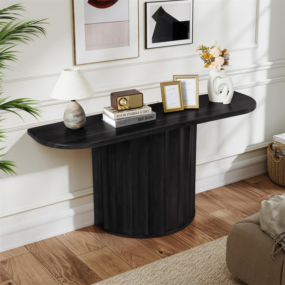 Black console table with decorative items in a living room setting