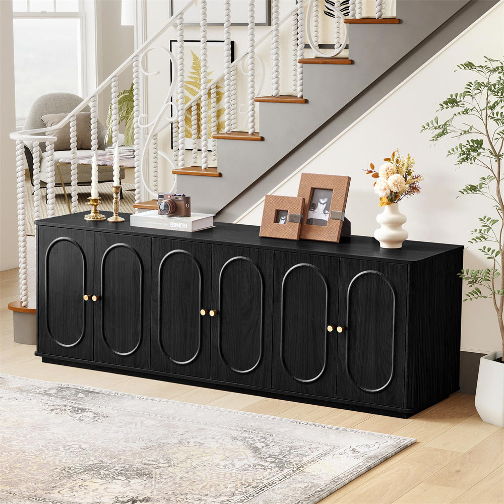 Black sideboard with decorative items in a living room setting