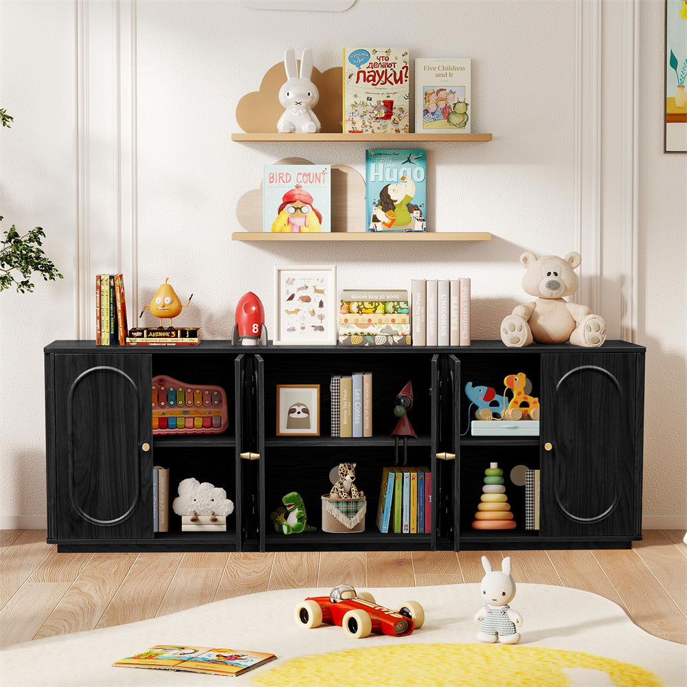 Children's room with black storage cabinet, books, toys, and decorative items on shelves.