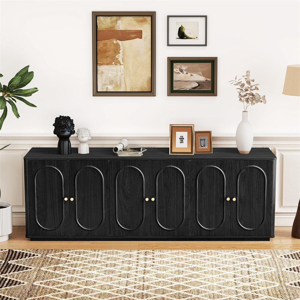 Black sideboard with decorative items in a living room setting