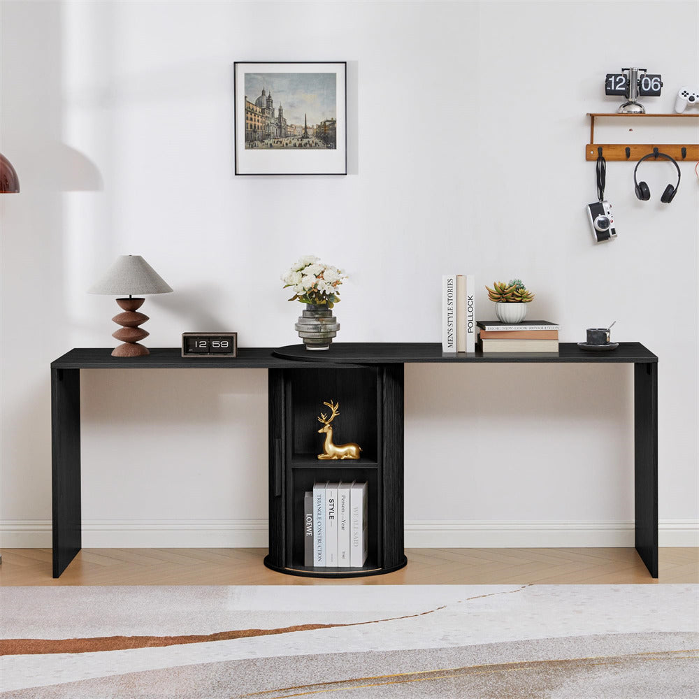 Black console table with decorative items against a white wall