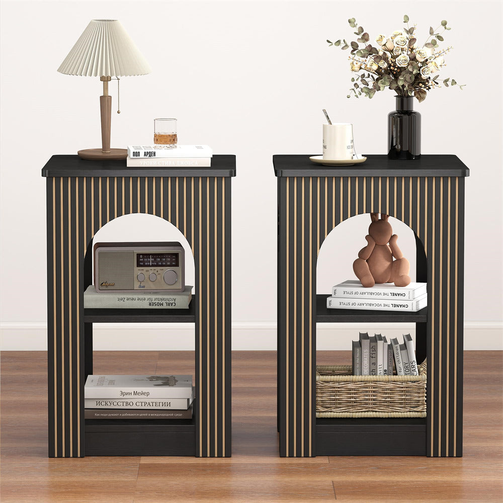 Two black and gold striped nightstands with decorative items on a wooden floor.