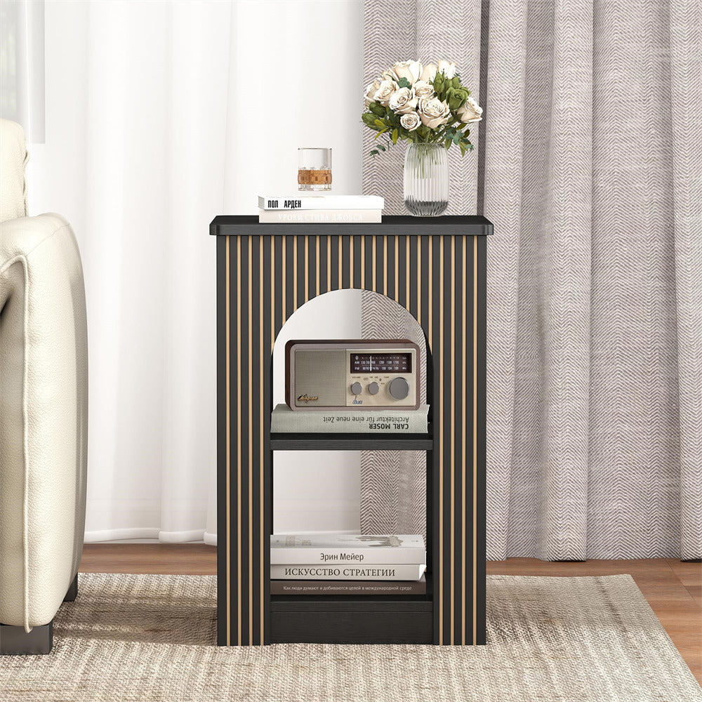 Small black side table with decorative items in a living room setting