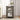 Small black side table with decorative items in a living room setting