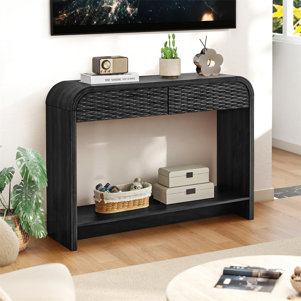 Black console table in a living room setting with decor items.