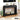 Black console table in a living room setting with decor items.