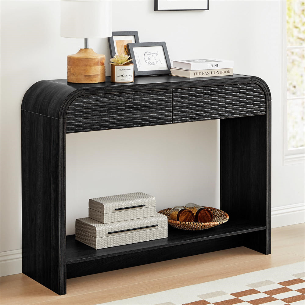 Black console table with decorative items in a room setting