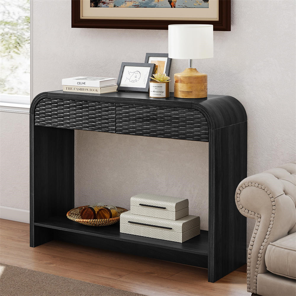 Black console table with decorative items in a living room setting