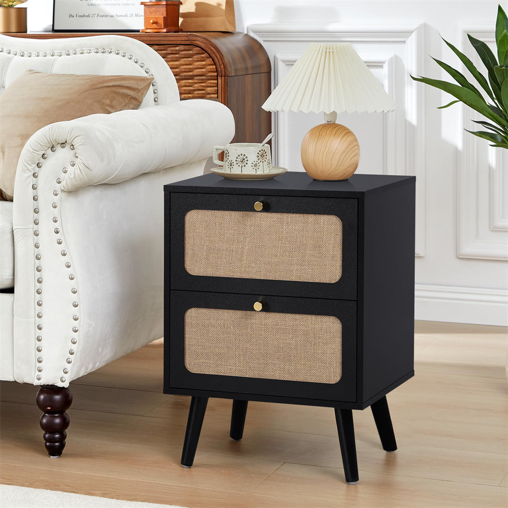 Black nightstand with woven drawers in a living room setting