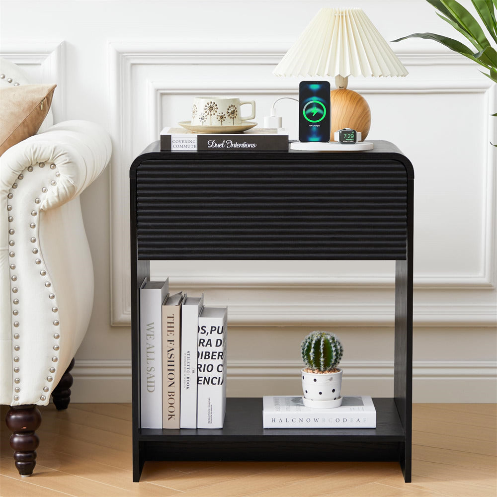 Black side table with decorative items in a living room setting