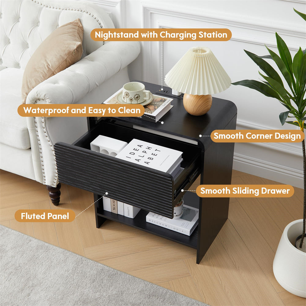 Black nightstand with charging station in a bedroom setting