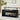 Black coffee table with lift-top design in a living room setting