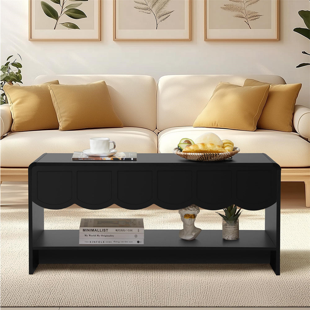 Living room with a beige sectional sofa, black coffee table, and decorative items.