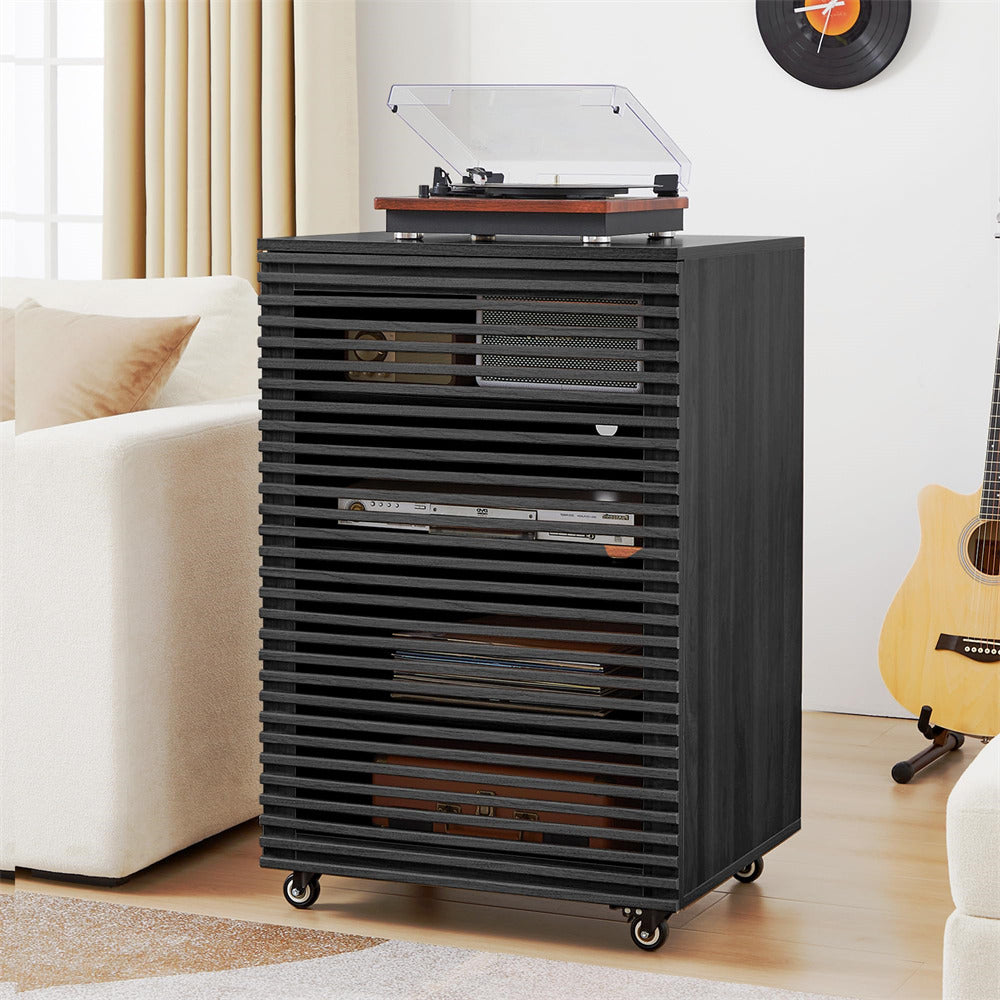 Black record player cabinet with a turntable inside, placed in a living room setting.
