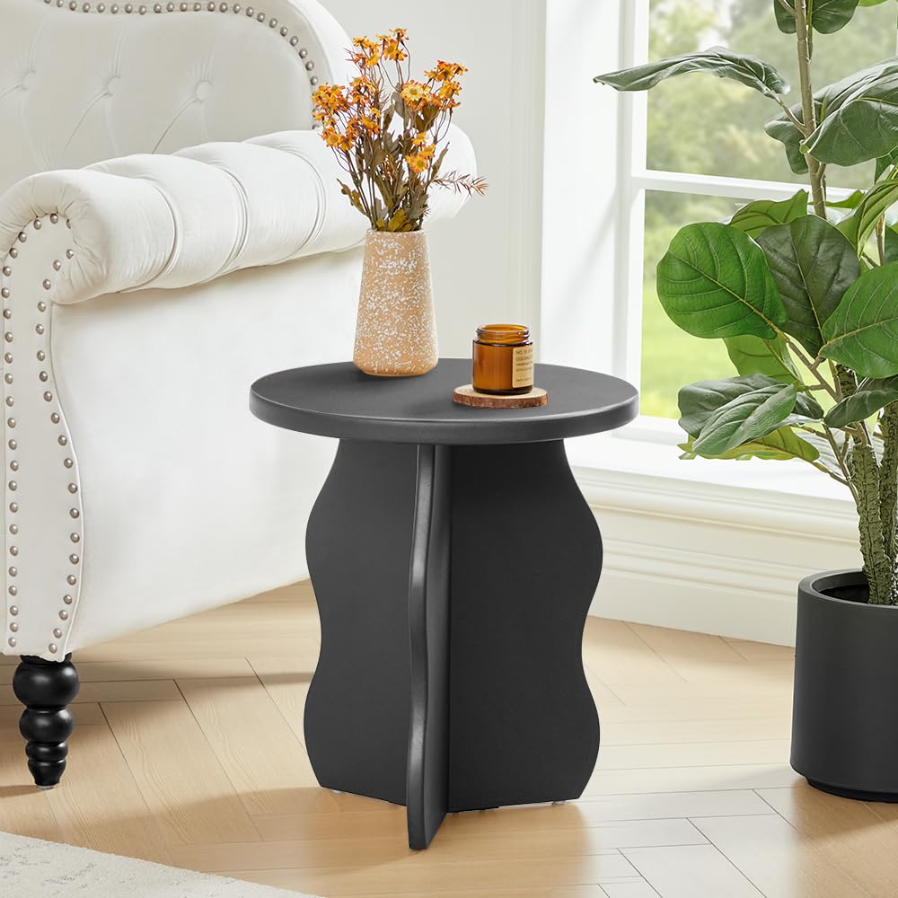 Black side table with decorative items in a home setting
