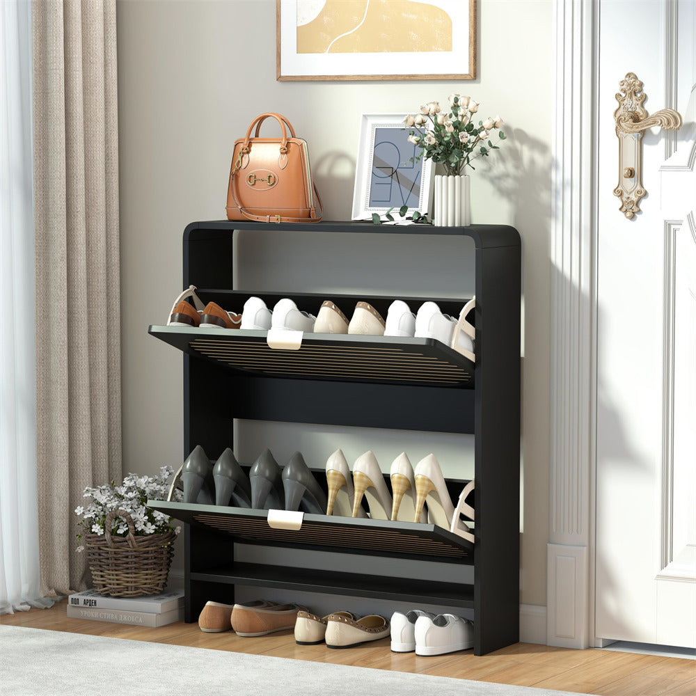 Black shoe rack with various shoes on a wooden floor in a room.