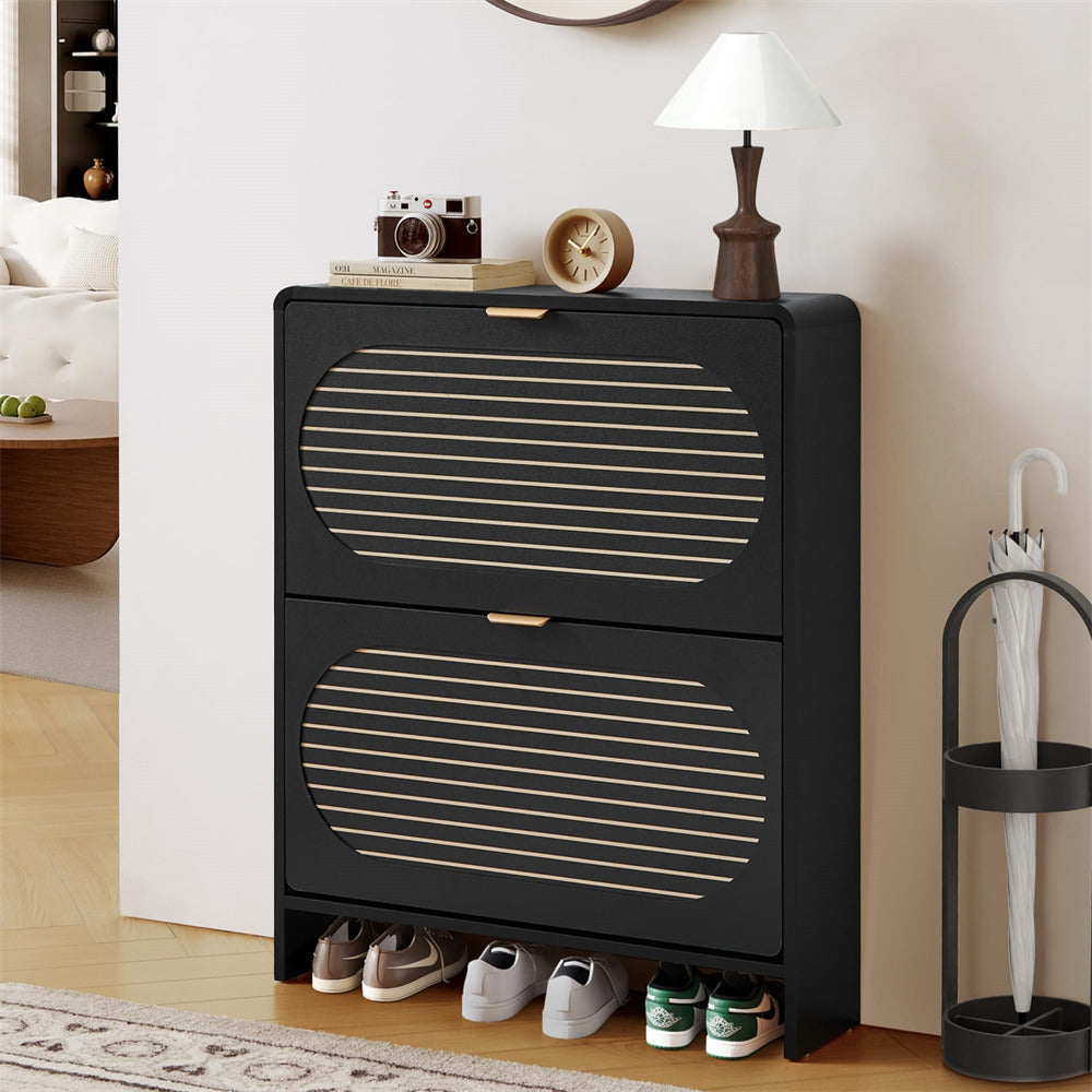 Black shoe cabinet with striped design, containing shoes and decor items, in a room setting.