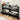 Black shoe rack with various shoes on a wooden floor.