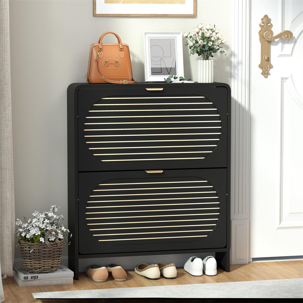 Black shoe cabinet with gold stripes in a room setting with shoes and decor items.