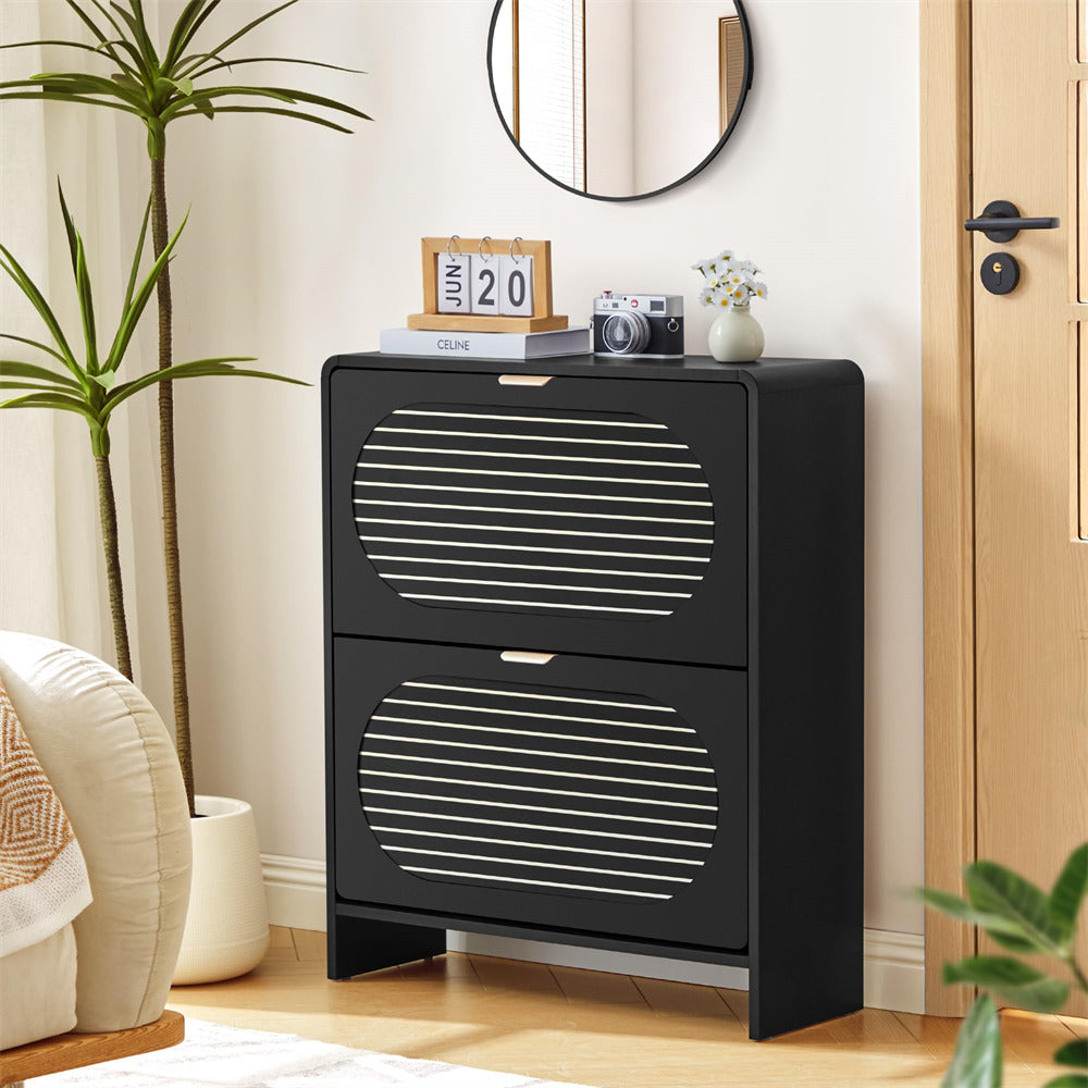 Black two-drawer cabinet in a room with decor elements.