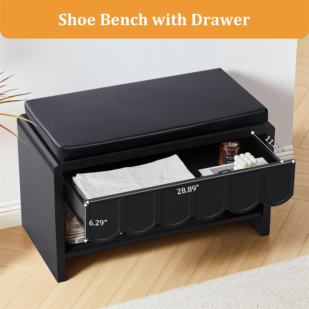 Black shoe bench with drawer on a wooden floor