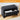 Black shoe bench with drawer on a wooden floor