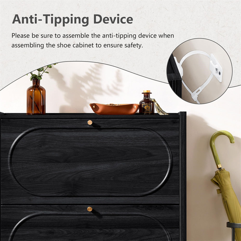 Black shoe cabinet with anti-tipping device highlighted, featuring a vase and bowl on top.
