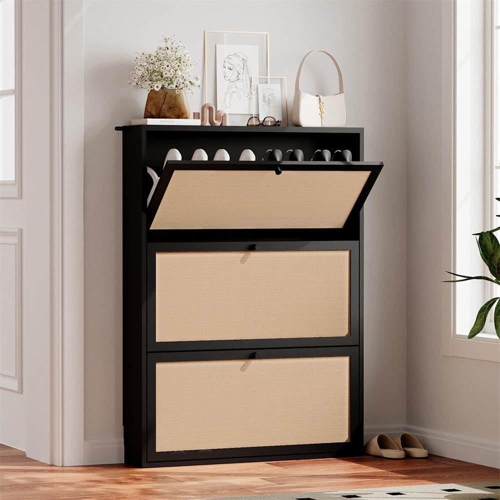 Black shoe cabinet with beige fabric doors in a room setting.