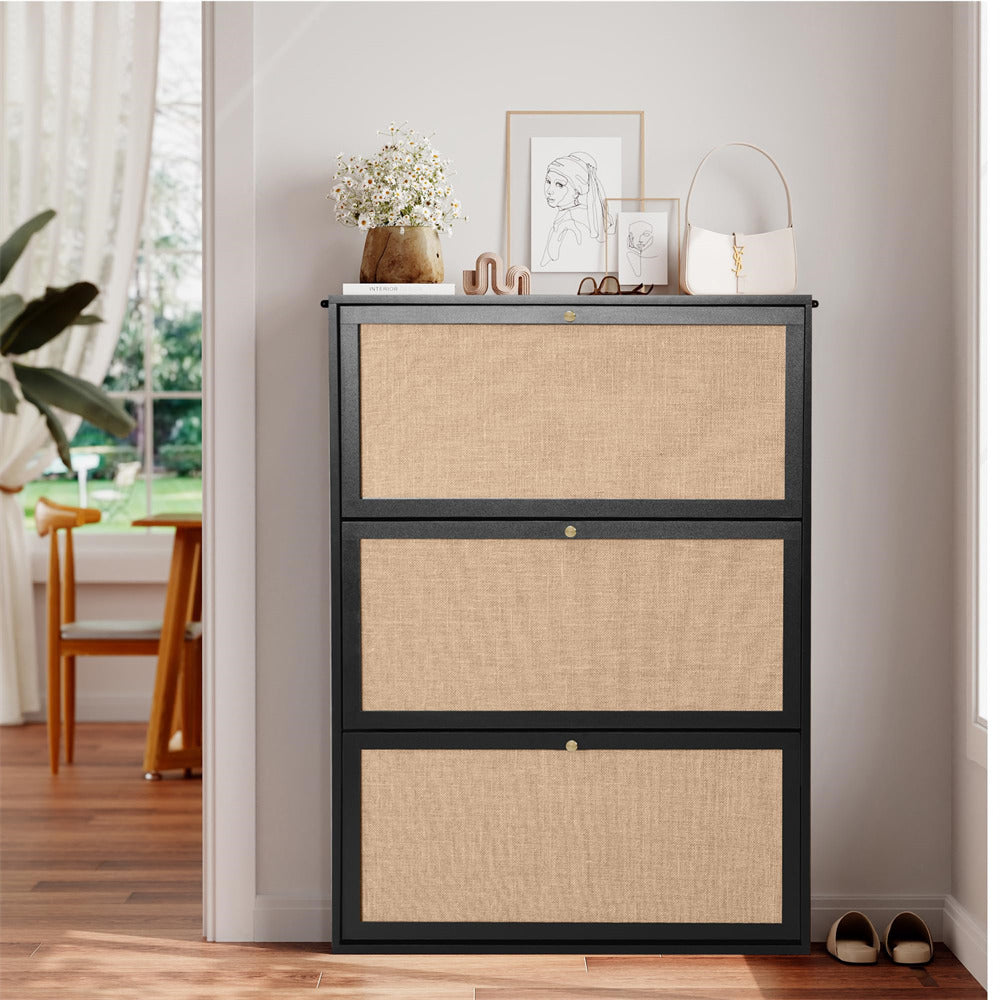 Three-drawer cabinet with woven drawers and black frame in a room setting.