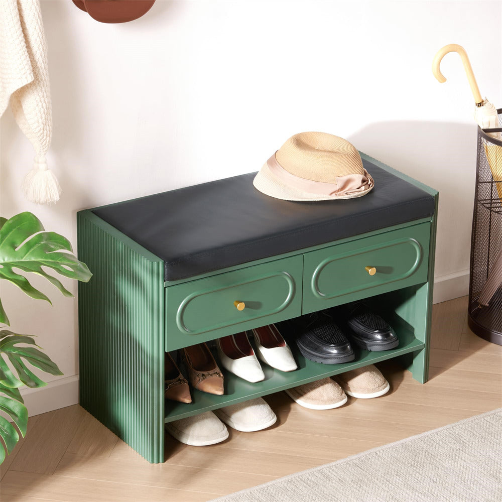 Green shoe bench with two drawers and shoe storage space, placed against a wall.