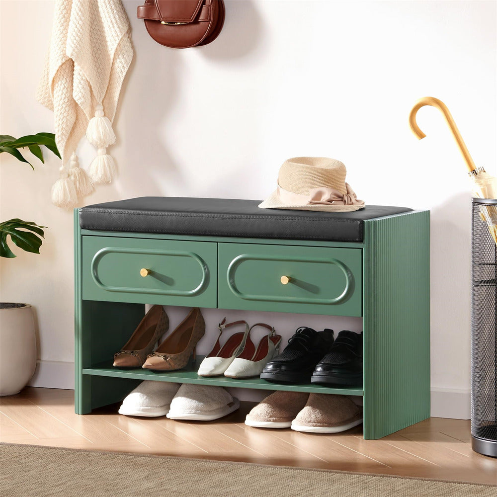 Green shoe storage bench with shoes underneath in a room setting.