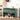 Green shoe storage bench with shoes underneath in a room setting.