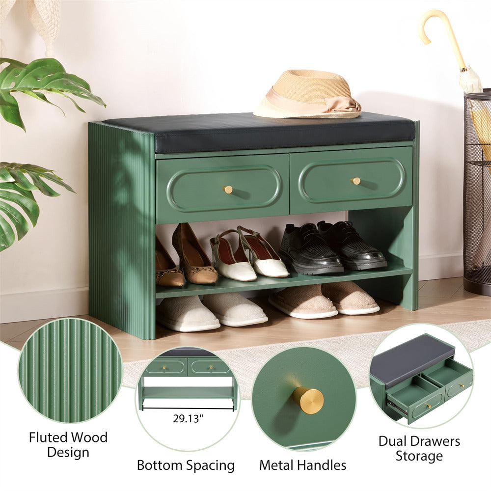 Green shoe cabinet with shoes inside, fluted wood design, metal handles, and dual drawers.
