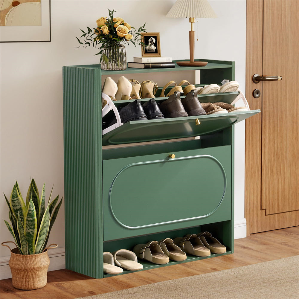 Green shoe cabinet with shoes inside, next to a plant and a door.