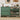 Green shoe cabinet with shoes inside, decorated room in the background