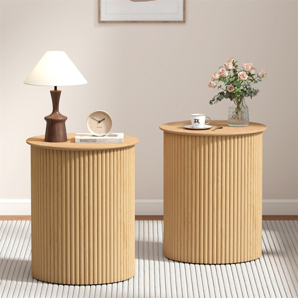 Two wooden side tables with decorative items in a room setting.