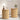 Two wooden side tables with decorative items in a room setting.